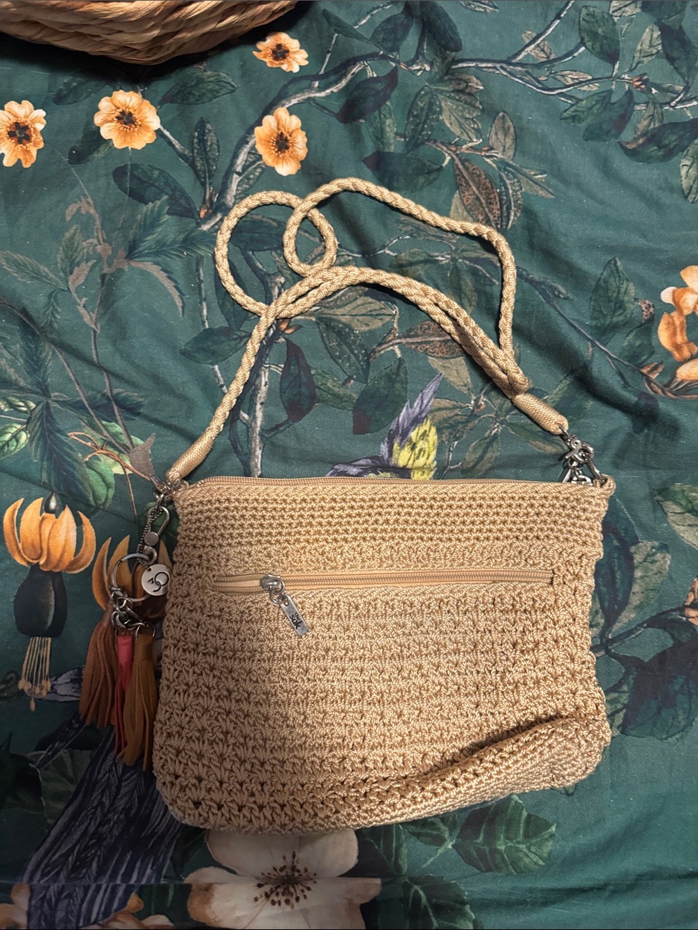 The Sak Beige Woven Crossbody Bag with Tassel Charm